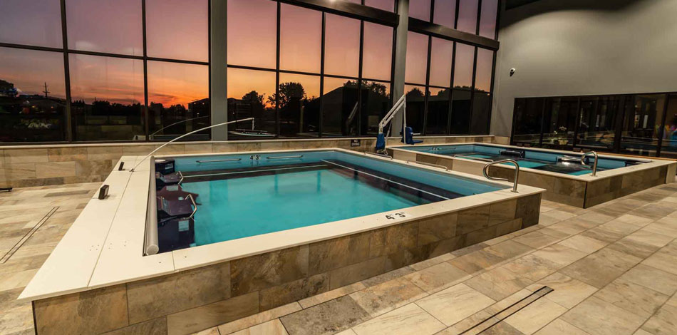 Rehab Pools with sunset through the windows